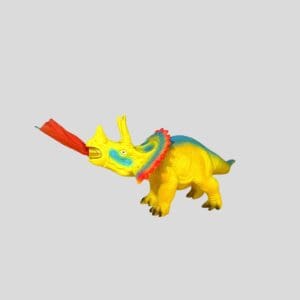 Toy dinosaur with colorful party blower.
